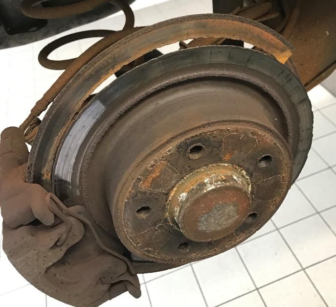 Rusted Corroded Dangerous Brake Disc ready to be repaired at Queens Park Garage Bournemouth
